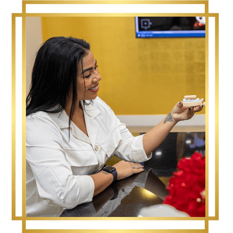 lady looking at dental implants